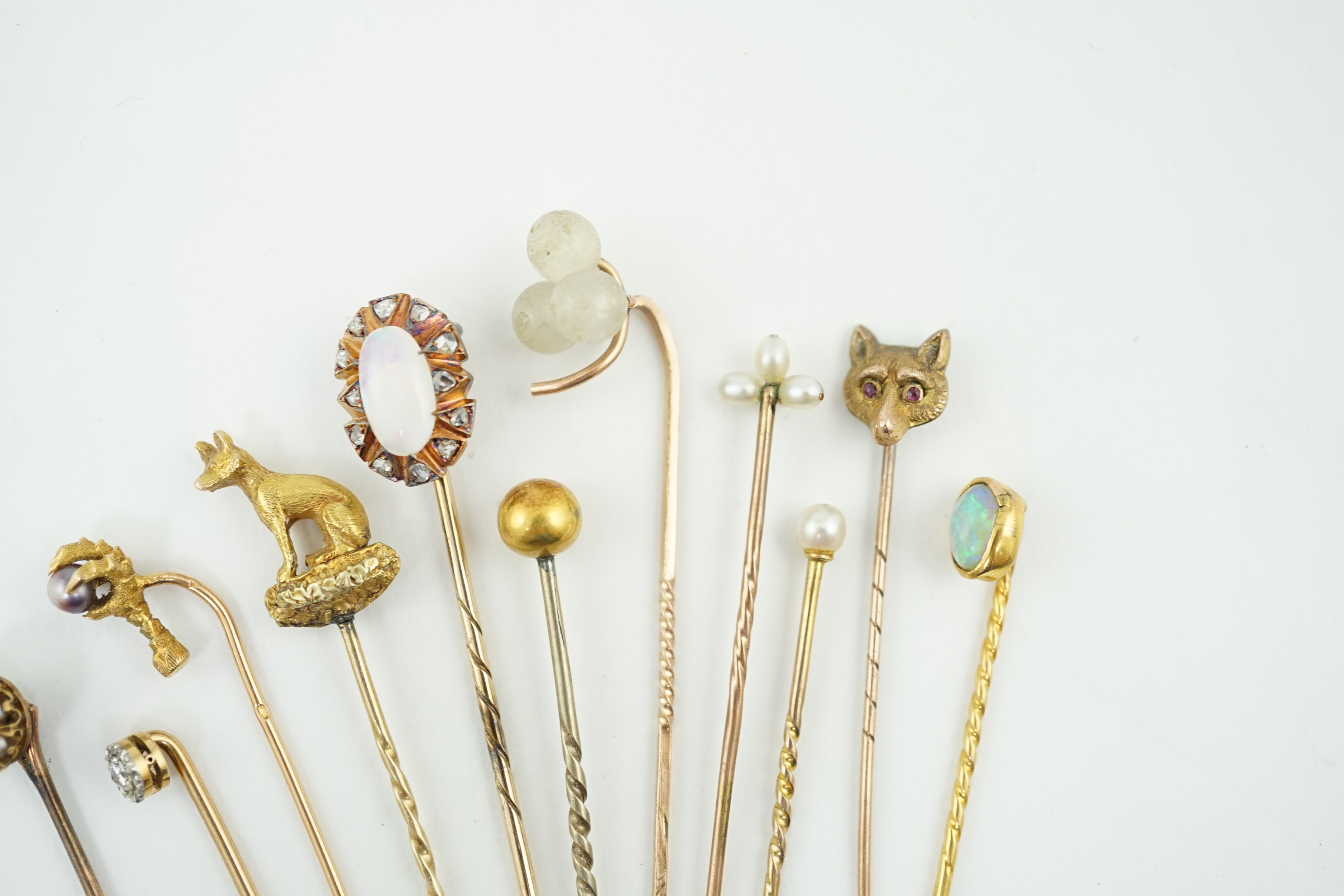 A collection of eleven assorted early 20th century and later stick pins